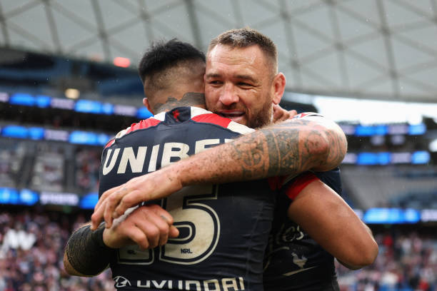 Jared Waerea-Hargreaves of the Roosters celebrates his 307th game for the Roosters with Spencer Leniu of the Roosters